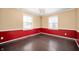 Empty dining room showcasing wainscoting and a modern light fixture at 3029 Oberlin Ct, Indianapolis, IN 46268