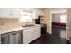 Well-lit kitchen with stainless steel appliances, white cabinetry, and a view into the adjacent dining area at 3029 Oberlin Ct, Indianapolis, IN 46268