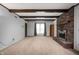Bright living room boasts a brick fireplace, exposed beams, and neutral carpeting at 3029 Oberlin Ct, Indianapolis, IN 46268