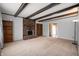 Spacious living room features a cozy fireplace with exposed brick and decorative ceiling beams at 3029 Oberlin Ct, Indianapolis, IN 46268