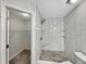 Bathroom features a tiled shower with built-in shelves and shower seat at 307 Beacon Point Ln, Fortville, IN 46040