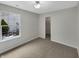 Bedroom with a large window and closet at 307 Beacon Point Ln, Fortville, IN 46040