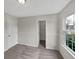 Carpeted bedroom featuring a window and open closet at 307 Beacon Point Ln, Fortville, IN 46040