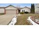 Charming single-story home with a well-maintained lawn and attached garage on a partly cloudy day at 307 Beacon Point Ln, Fortville, IN 46040