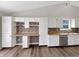 Spacious kitchen featuring white cabinets, stainless steel appliances and tile backsplash at 307 Beacon Point Ln, Fortville, IN 46040