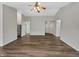 Spacious living room with hardwood floors and vaulted ceiling, ready for personalization at 307 Beacon Point Ln, Fortville, IN 46040