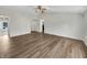 Bright living room with hardwood floors and vaulted ceiling offering open space and natural light at 307 Beacon Point Ln, Fortville, IN 46040