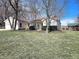 Exterior view of home with attached garage and shed, surrounded by trees and yard at 310 E Main St, Monrovia, IN 46157