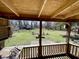 View of the large green backyard, including a shed, as seen from the back porch at 3120 Central Ave, Anderson, IN 46016