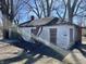 Exterior elevation of a home with siding, bare trees, and light through the trees at 3120 Central Ave, Anderson, IN 46016