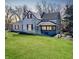 Cozy home featuring a well-manicured lawn and inviting front porch at 3120 Central Ave, Anderson, IN 46016