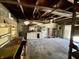 Wide garage featuring concrete block walls and shelving at 3120 Central Ave, Anderson, IN 46016