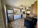 Functional kitchen featuring stainless steel refrigerator and plenty of counter space at 3120 Central Ave, Anderson, IN 46016