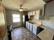Galley kitchen featuring a window over the sink and ample storage at 3120 Central Ave, Anderson, IN 46016