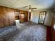 Spacious living room with wood paneling at 3120 Central Ave, Anderson, IN 46016
