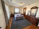 Comfortable bedroom with hardwood floors, neutral paint, and large area rug at 34 W Main St, Brownsburg, IN 46112