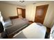 Bedroom featuring two beds, hardwood floors, neutral colored walls, and one window at 34 W Main St, Brownsburg, IN 46112