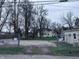 A large open lot with trees in the front and a home in the distance at 34 W Main St, Brownsburg, IN 46112