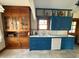 Bright kitchen featuring custom blue cabinets, white appliances, and natural wood trim at 34 W Main St, Brownsburg, IN 46112