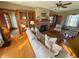Inviting living room featuring hardwood floors, brick fireplace and beautiful built-in cabinets at 34 W Main St, Brownsburg, IN 46112