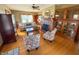 Inviting living room featuring hardwood floors, brick fireplace and beautiful built-in cabinets at 34 W Main St, Brownsburg, IN 46112