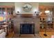 Inviting living room featuring a brick fireplace and built-in bookshelves at 34 W Main St, Brownsburg, IN 46112