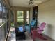 Relaxing screened-in porch with comfortable seating and a view of the neighborhood at 34 W Main St, Brownsburg, IN 46112
