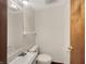 Half bathroom featuring a vanity with sink and a toilet at 3509 River Bluff Rd, Anderson, IN 46012