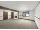 Spacious living room featuring a fireplace, large window, and neutral decor at 3509 River Bluff Rd, Anderson, IN 46012