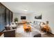 Bright living room with modern furnishings, plush rug, and large window at 3509 River Bluff Rd, Anderson, IN 46012