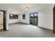 Bright and open living room with sliding glass door and large windows at 3509 River Bluff Rd, Anderson, IN 46012