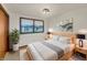 Comfortable main bedroom with a queen bed, stylish nightstands, and bright natural light at 3509 River Bluff Rd, Anderson, IN 46012