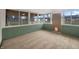 Bright sunroom with multiple windows, backyard views, and access door at 3509 River Bluff Rd, Anderson, IN 46012