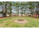 Large backyard with a firepit area and view of mature trees at 3602 N County Road 950 E, Brownsburg, IN 46112