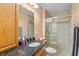 Bathroom featuring a granite countertop, wooden cabinets, and a glass enclosed shower at 3602 N County Road 950 E, Brownsburg, IN 46112