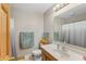 Bathroom with a wooden vanity, neutral walls, and a shower with curtain at 3602 N County Road 950 E, Brownsburg, IN 46112