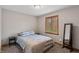 Bright bedroom featuring light blue accents, a cozy rug, and a full-length mirror at 3602 N County Road 950 E, Brownsburg, IN 46112