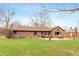 View of the home's exterior with well-maintained lawn and a spacious patio at 3602 N County Road 950 E, Brownsburg, IN 46112