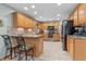 Spacious kitchen featuring a breakfast bar, granite countertops, stainless appliances, and ample storage at 3602 N County Road 950 E, Brownsburg, IN 46112