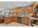 Updated kitchen featuring granite countertops, tile backsplash, and ample wood cabinetry for stylish storage solutions at 3602 N County Road 950 E, Brownsburg, IN 46112
