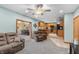 Open-concept living room seamlessly connects to the kitchen and a bar area, offering an inviting space for gathering at 3602 N County Road 950 E, Brownsburg, IN 46112