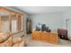 Well-lit office area featuring a classic wooden desk, neutral walls, and a comfortable leather chair, perfect for productivity at 3602 N County Road 950 E, Brownsburg, IN 46112