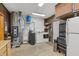 Utility room featuring a washer and dryer, water heater, and storage cabinets at 3602 N County Road 950 E, Brownsburg, IN 46112