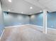 Finished basement area featuring plush carpeting, column support and speaker system at 3705 River Rd, Columbus, IN 47203