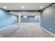 Finished basement area featuring plush carpeting, column support and recessed lights at 3705 River Rd, Columbus, IN 47203
