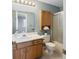Bathroom with wood vanity, mirrored wall cabinet, and shower/tub combination at 3705 River Rd, Columbus, IN 47203