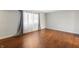 Bedroom with beautiful hardwood floors and large windows at 3705 River Rd, Columbus, IN 47203