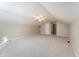 Bedroom features neutral carpeting, a ceiling fan, and attic ceilings at 3705 River Rd, Columbus, IN 47203