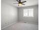 Bedroom features neutral carpeting, a ceiling fan, and a window that provides natural light at 3705 River Rd, Columbus, IN 47203