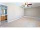 Spacious bedroom with plush carpet and a view of the en-suite bathroom at 3705 River Rd, Columbus, IN 47203